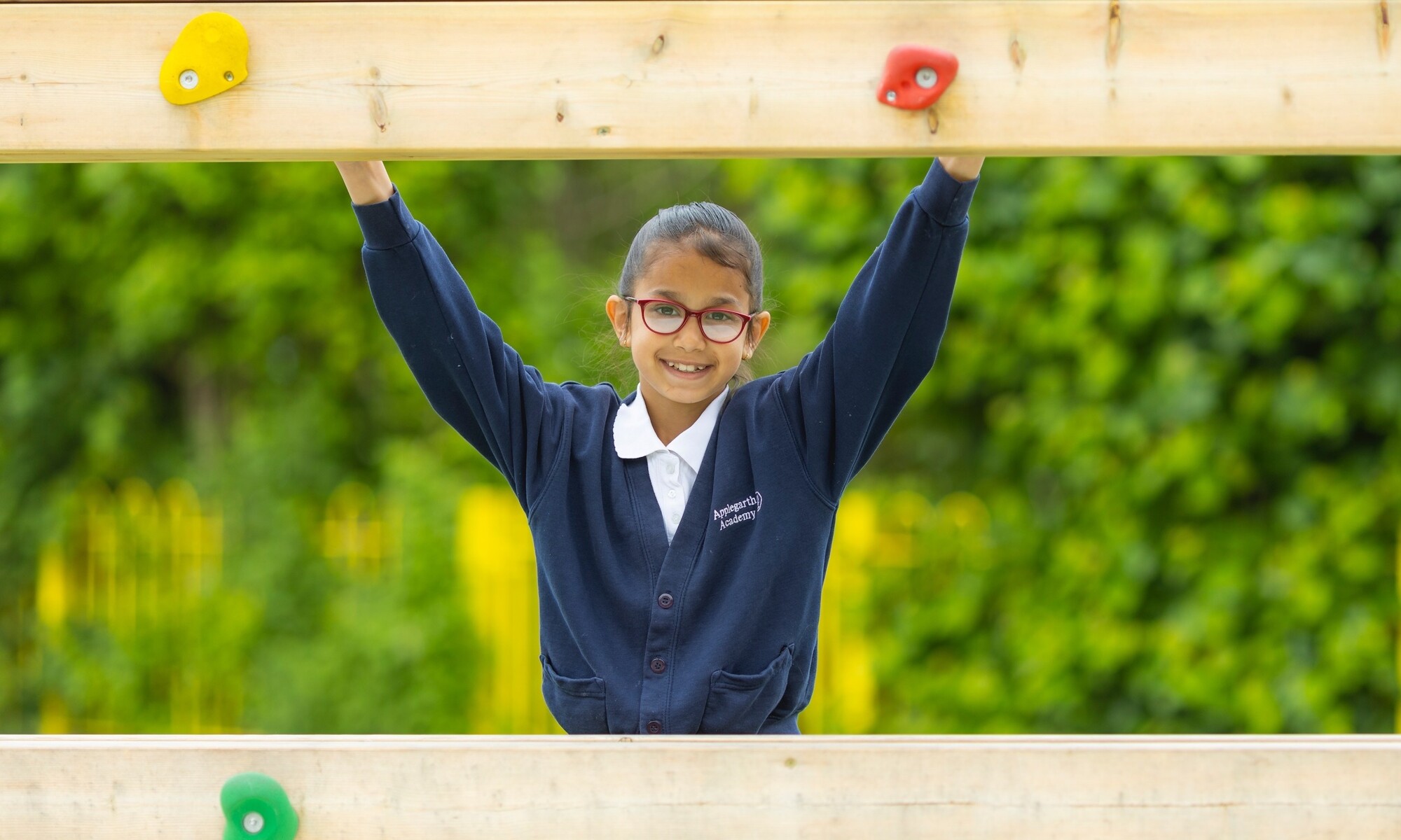 Applegarth Academy Image of Pupils on the climbing frame at play time